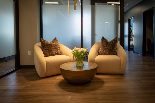 An intake waiting room with comfortable seating and soft lighting