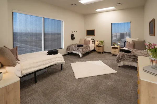 One of the women’s bedrooms, each housing three patients with their own double bed and nightstands