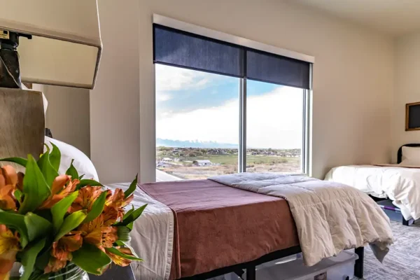One of the Phoenix women’s bedrooms, each housing three patients with their own double bed and nightstands